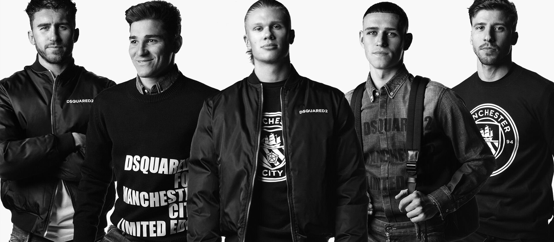 Picture in black and white with Manchester City players and coach wearing the new dsquared2 manchester city capsule collection 